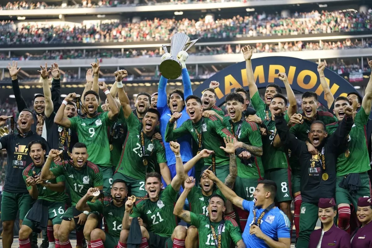 Mexico celebrate with the winner’s trophy in the CONCACAF Gold Cup